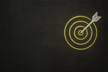 High-resolution stock photo of a blackboard with a chalk drawing of a target and an arrow hitting the bullseye. Concept image for goals, focus, achievement, and success. Minimal professional composition with wide copy space for business or motivational text.の素材