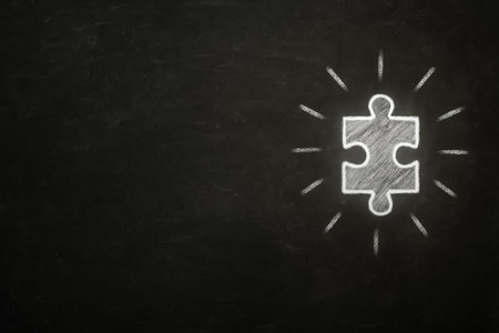 High-resolution stock photo of a blackboard with a chalk drawing of a single puzzle piece in white color. Concept image representing teamwork, collaboration, problem solving, and strategy. Minimal style with large copy space for business, education, or creative text and branding. Keywords (35):の素材