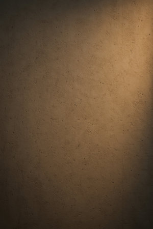 Abstract vertical background of a concrete wall with warm side lighting. Minimal and modern rough texture, perfect for creative, stylish, and contemporary design projects.の素材