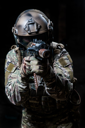 Russian army soldiers in a mask shoots a machine gunの写真素材