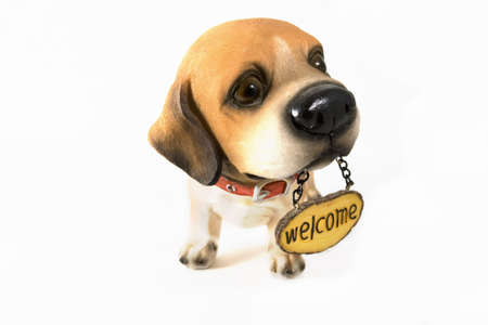 ceramic welcome dog on white backgroundの写真素材