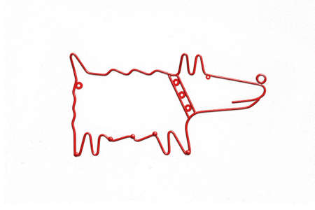metal red dog hanger on white backgroundの写真素材