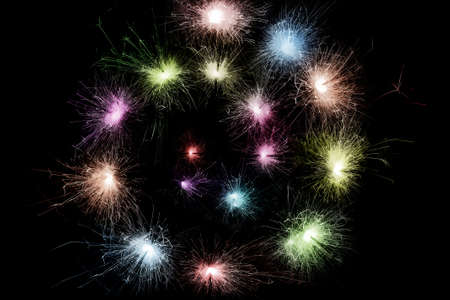 color sparkler spiral isolated on black backgroundの写真素材