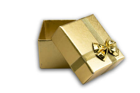 golden gift box isolated on whiteの写真素材