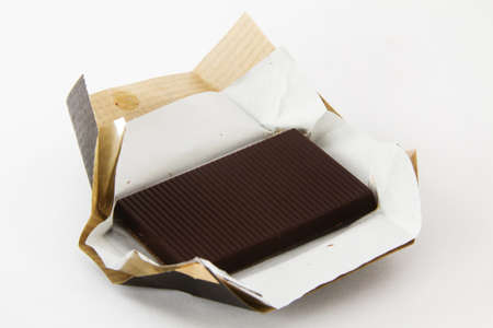 dark chocolate with brown paper wrappingの写真素材