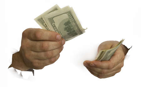 man's hands hold one hundred dollar bills