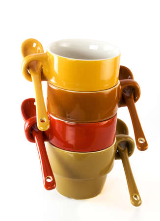 ceramic colorful coffee cups with spoonsの写真素材