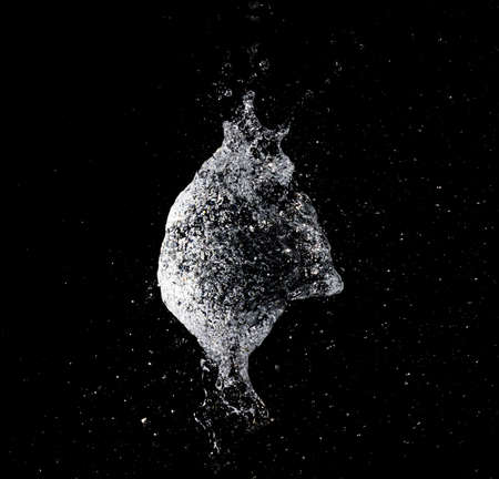 a big water balloon  bomb splash explosionの写真素材