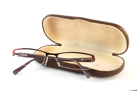 opened brown tiger leather spectacle case with glassesの写真素材