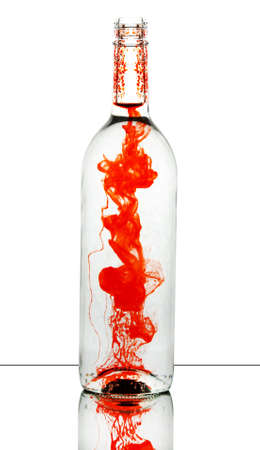 bottle with red vine on white backgroundの写真素材