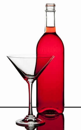 red vine bottle and martini glass on white backgroundの写真素材