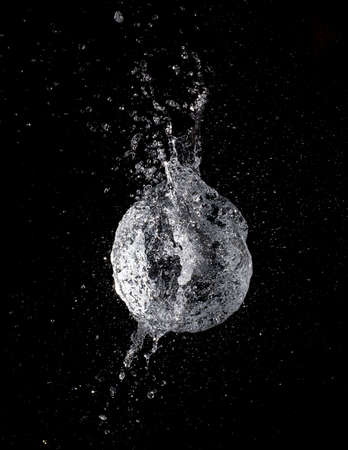 water balloon explosion is caught on cameraの写真素材