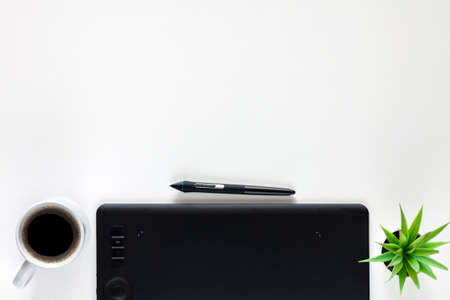 Graphic tablet on a white empty background. Copy space. Computer graphics desk.の写真素材