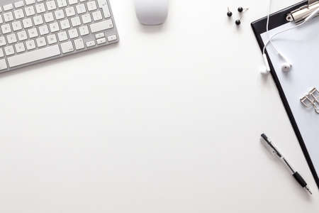White office desk with copy space. Technology. Work in a corporation. View from above. Office supplies.の写真素材