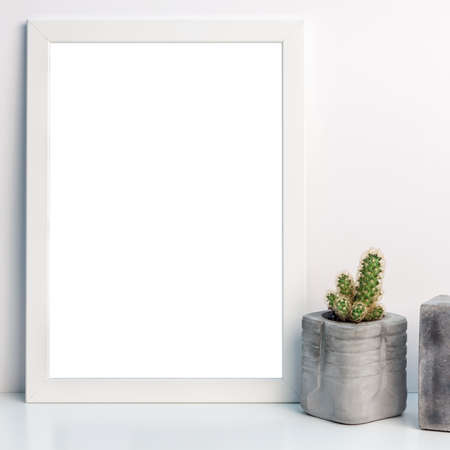 White mockup frame with cactus in a concrete potの写真素材