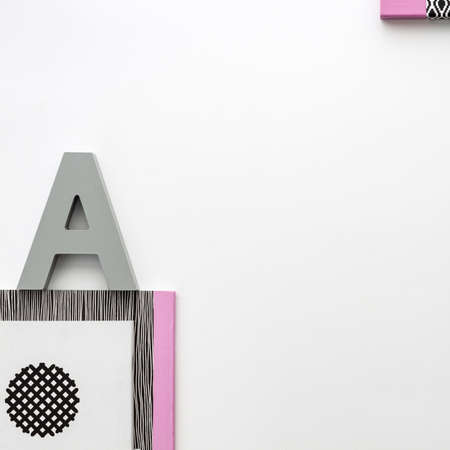 Office table top view with white space for your text. Black and white concept with pink elements. Top view real photo. Geometrical styleの写真素材