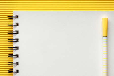 White blank sketchbook with space for text. Mockup. Yellow frame with ribbed paper. Minimal geometrical compositionの写真素材
