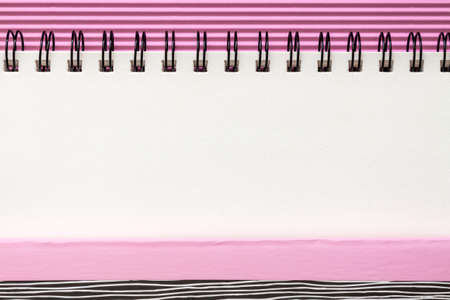 White blank sketchbook with space for text. Mockup. Pink pastel frame. Minimal geometrical compositionの写真素材