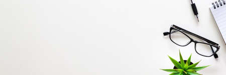 White desk with copy space. Home office. View from above. Business desk. Office supplies. Panorama.の写真素材