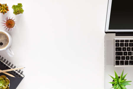 Home desk. Office supplies. Laptop, notebook and coffee. Copy space.の写真素材