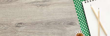 Wooden desk. Top view. Copy space. Creative person's desk. Bannerの写真素材