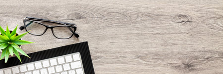 Wooden desk. Top view. Copy space. Home office. Remote work. Bannerの写真素材