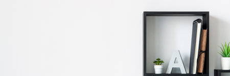 Home office. Homework. Black square shelves. Succulents as decoration. White wall copy space. Banner. Panorama.の写真素材