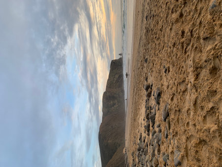 Waves breaking on the beach at sunset, Algarveのeditorial素材