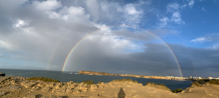 Rainbow over the Atlantic Ocean in Peniche, Portugalのeditorial素材