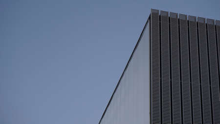 close-up facade of modern building against blue backgroundのeditorial素材