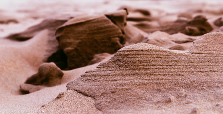 Close-up of sand shaped by water and windの写真素材