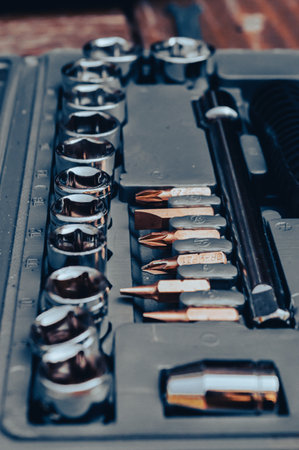 Vertical image of a rattle toolset in a gray plastic boxの写真素材