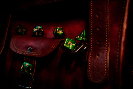Image of a green set of role-playing gaming dice focused on the 6-sided die in warm lightの写真素材