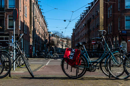 Amsterdam, The Netherlands, March 5, 2022: Image of a bike with panniers with the Amsterdam Crestのeditorial素材