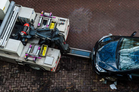 Amsterdam, The Netherlands February 25, 2022. A Car getting towed in Amsterdam, The Netherlandsのeditorial素材