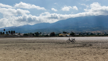 Kos, Greece September 18, 2022: Image of a bike in Alikes Salt lakeの写真素材