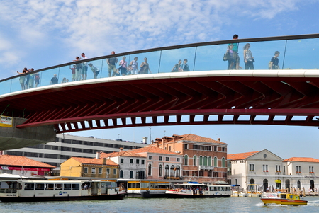 Venice, Italy - August 4, 2011: Tourists walking across the Ponte della Constituzione which was opened to the public on September 11, 2008.  Locals and tourists now refer to it as the Ponte di Calatrava.のeditorial素材