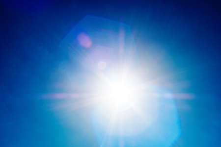 Shining sun at clear blue skyの写真素材