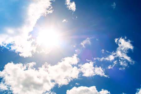 Shining sun at clear blue skyの写真素材
