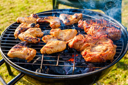 Cooking barbecue meat on an open fireの写真素材