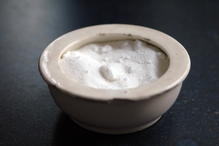 old white and tattered pot with salt の写真素材