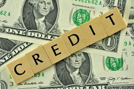 Word credit in lettern on background of dollar banknotesの写真素材