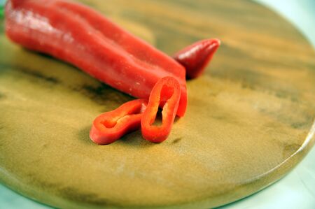 Peperoni cutted on a boardの写真素材