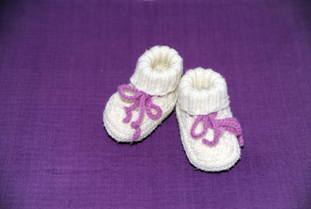 Lilac babyshoes, knitted from new wool の写真素材