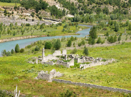 Meadows and ruins at the entrance of Mont-Rebei gorgeの写真素材