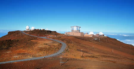 View of observatories from summit of Haleakala volcano in Maui island, Hawaiiの写真素材