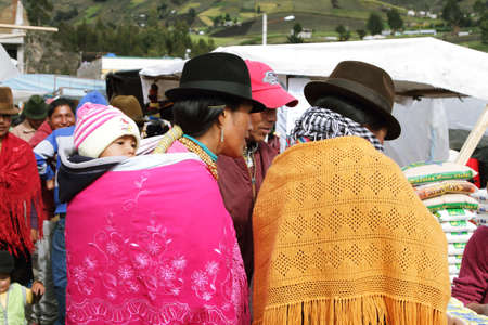 ZUMBAHUA, ECUADOR - APRIL 19: Ecuadorian ethnic people with indigenous clothes in a rural Saturday market on April 19, 2014 in Zumbahua village, Ecuador.のeditorial素材