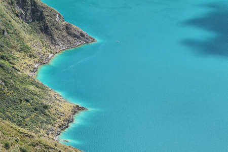 Amazing view of  lake of the Quilotoa caldera. Quilotoa is the western volcano in Andes range and is located in andean region of Ecuador.の写真素材