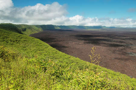 Volcanic landscape of the big crater of Sierra negra volcano in Isabela island, Galapagos, Ecuador. This crater is the second largest in the word after yellowstone national park.の写真素材