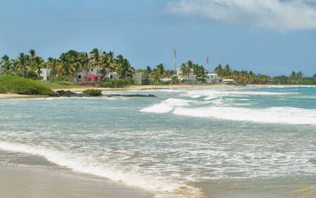 White sand beach in Isabela island with Puerto Villamil at background, Galapagos Islands, Ecuadorの写真素材